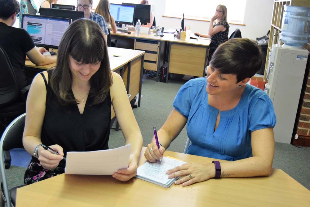 Organisation Image (Enhance EHC: Two people working on a document in the office)