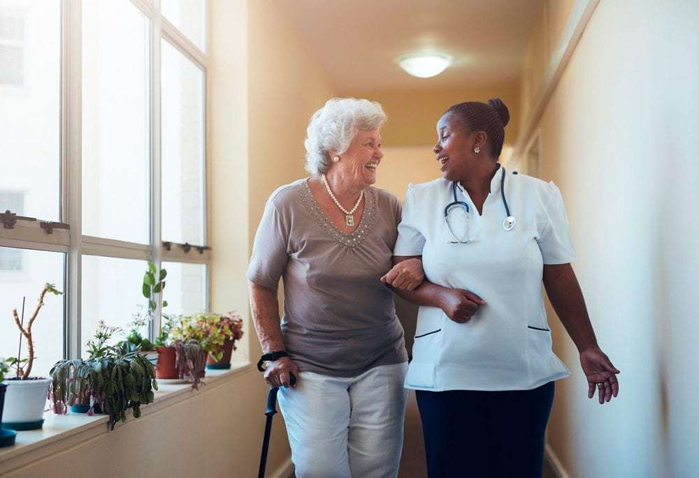 Company Image (Hales Care: Carer and Resident chatting)