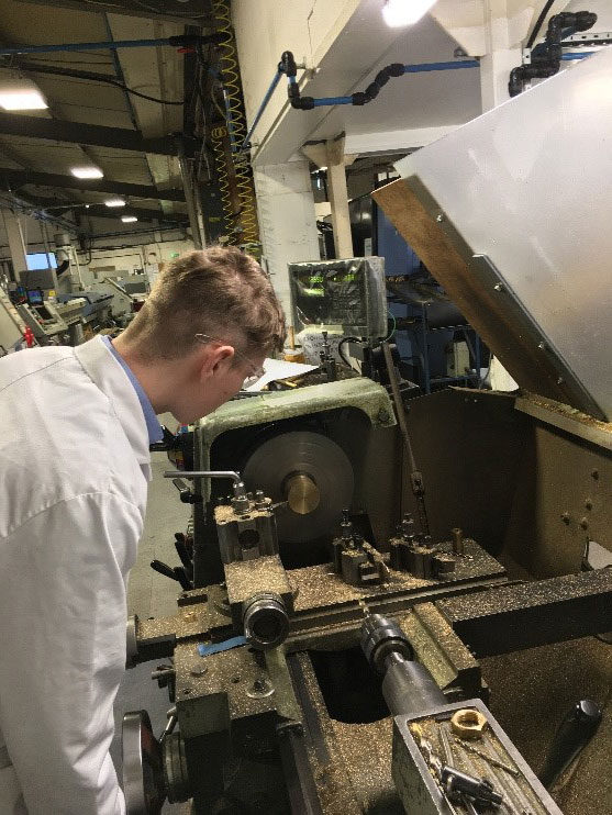 Company Image (GASARC: Apprentice using some machinery)