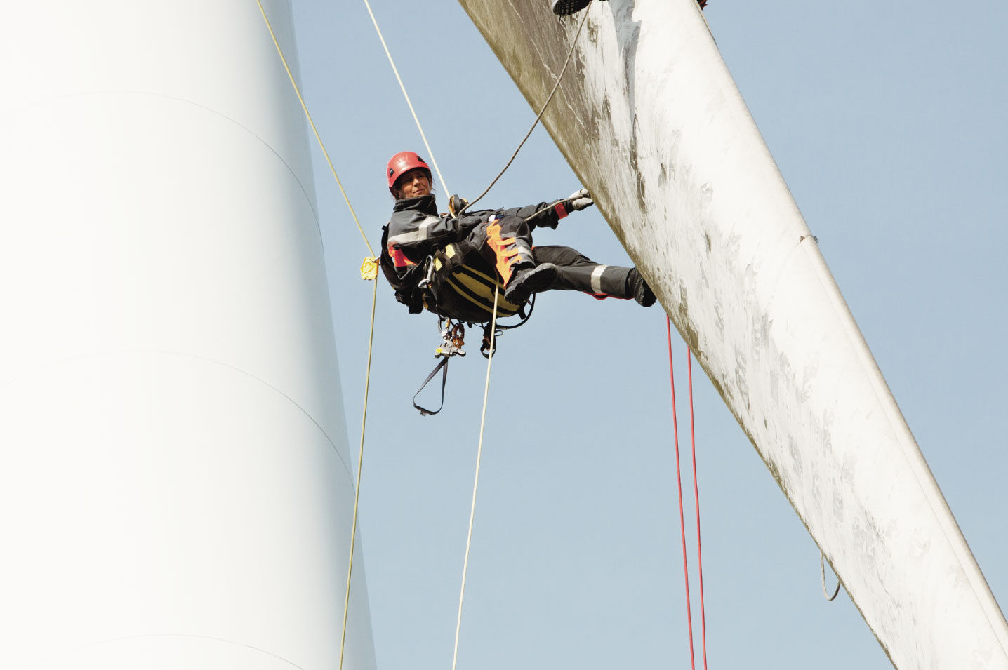 Company Image (Vattenfall: Woman on top of Wind Turbine - blade)